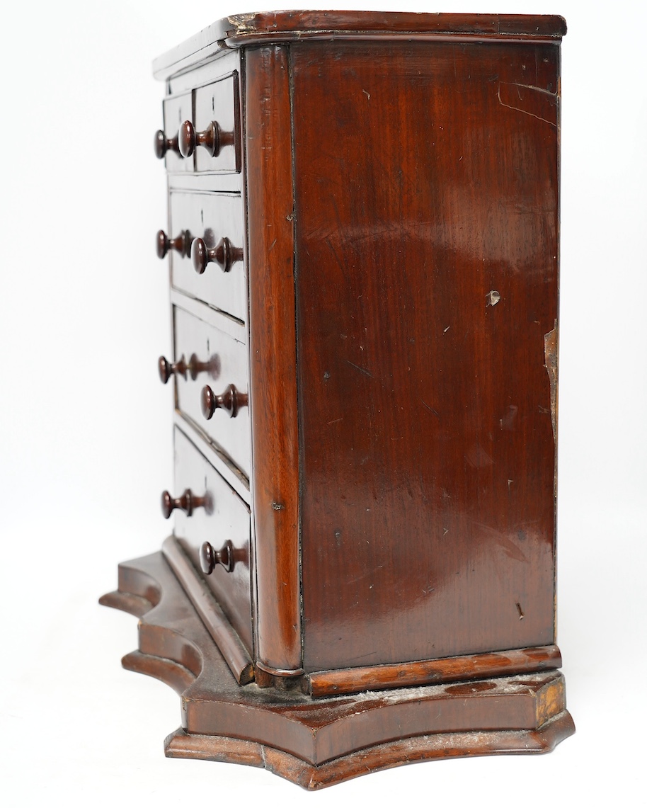 A Victorian mahogany miniature chest, on shaped plinth, 50cm wide, 49cm high. Condition - fair